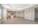 Open living room with tile floors and access to kitchen and patio at 21628 Lake Placid Way, Venice, FL 34293