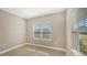 Bright home office features tile flooring, neutral walls, and large windows at 21628 Lake Placid Way, Venice, FL 34293