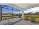 Spacious screened porch with paver patio and backyard view at 21628 Lake Placid Way, Venice, FL 34293