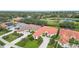 Aerial view of homes with tile roofs and green lawns at 2482 Dick Wilson Dr, Sarasota, FL 34240