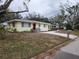 Front view of a remodeled light yellow single-story house at 2614 8Th W Ave, Bradenton, FL 34205