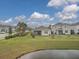 Home features a backyard with pond view at 3206 Hilltop Cir, Bradenton, FL 34211