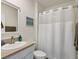 Guest bathroom with a shower/tub combo and white vanity at 3206 Hilltop Cir, Bradenton, FL 34211