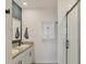 Bathroom boasts double sinks, subway tile shower, and white cabinets at 3206 Hilltop Cir, Bradenton, FL 34211