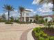 Community clubhouse with landscaping and palm trees at 3206 Hilltop Cir, Bradenton, FL 34211