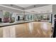 Bright fitness studio with wood floors, mirrors, and equipment at 3206 Hilltop Cir, Bradenton, FL 34211