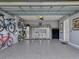 Garage with epoxy flooring, bike storage, and built-in cabinets at 3206 Hilltop Cir, Bradenton, FL 34211