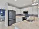 Modern kitchen with white cabinets, granite counters and stainless steel appliances at 3206 Hilltop Cir, Bradenton, FL 34211