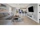 Open living room with a view of the kitchen and bar seating at 3206 Hilltop Cir, Bradenton, FL 34211