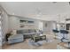 Spacious living room with sectional sofa and large TV at 3206 Hilltop Cir, Bradenton, FL 34211