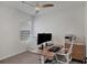 Home office with a desk, two monitors, and ceiling fan at 3206 Hilltop Cir, Bradenton, FL 34211