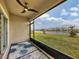 Relaxing screened patio overlooking a pond and community at 3206 Hilltop Cir, Bradenton, FL 34211