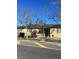 Ranch style home with a well-maintained exterior and mature trees at 3301 N Avenida Republica De Cuba, Tampa, FL 33605