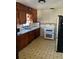 Classic kitchen featuring wood cabinets and modern appliances at 3301 N Avenida Republica De Cuba, Tampa, FL 33605