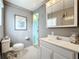 Bathroom with toilet, sink, and vanity at 3333 26Th E Ave # 1241, Bradenton, FL 34208