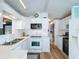 Clean kitchen with white cabinets and modern appliances at 3333 26Th E Ave # 1241, Bradenton, FL 34208