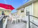 Relaxing patio with seating area, umbrella, and access to the home at 3333 26Th E Ave # 1241, Bradenton, FL 34208