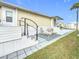 Spacious patio with lounge chairs and a patterned rug at 3333 26Th E Ave # 1241, Bradenton, FL 34208