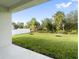 Spacious backyard with grassy area and privacy fence at 3425 Dryden St, North Port, FL 34288