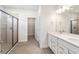 Modern bathroom with double vanity and large shower at 3425 Dryden St, North Port, FL 34288