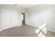 Bright bedroom with double doors and tile flooring at 3425 Dryden St, North Port, FL 34288