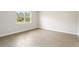 Simple bedroom with tile flooring and a window at 3425 Dryden St, North Port, FL 34288