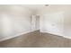 Spacious bedroom with double doors and tile flooring at 3425 Dryden St, North Port, FL 34288