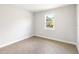 Well-lit bedroom featuring tile floors and a window at 3425 Dryden St, North Port, FL 34288
