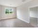 Dining room with tile flooring and light-filled window at 3425 Dryden St, North Port, FL 34288