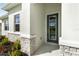 Modern front entrance with gray door and stone accents at 3425 Dryden St, North Port, FL 34288