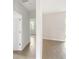Clean and bright hallway with tile flooring and access to other rooms at 3425 Dryden St, North Port, FL 34288