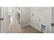Laundry room with tile floor, shelving and space for a full-size washer and dryer at 3425 Dryden St, North Port, FL 34288