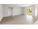 Spacious living room with tile floors and sliding glass doors at 3425 Dryden St, North Port, FL 34288