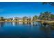Enjoy the tranquility of this home's backyard view featuring ducks swimming on the waters of the lake at 3663 Muirfield Dr # 4B, Sarasota, FL 34238
