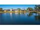 This home features a serene backyard view with calm lake waters and ample space for enjoying the outdoors at 3663 Muirfield Dr # 4B, Sarasota, FL 34238