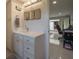 Bright bathroom with a large vanity, quartz countertop, and access to a bonus room at 3663 Muirfield Dr # 4B, Sarasota, FL 34238
