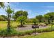 Enjoy community amenities such as the outdoor grill and picnic table, nestled among lush landscaping at 3663 Muirfield Dr # 4B, Sarasota, FL 34238