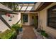 Charming courtyard with decorative accents, potted plants, and a welcoming ambiance at 3663 Muirfield Dr # 4B, Sarasota, FL 34238