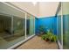 Private courtyard filled with lush greenery, leading to interior rooms at 3663 Muirfield Dr # 4B, Sarasota, FL 34238