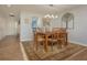 Charming dining room with wood table and seating for six guests at 3663 Muirfield Dr # 4B, Sarasota, FL 34238