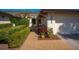 Inviting entrance with lush greenery and a quaint walkway leading to the front door at 3663 Muirfield Dr # 4B, Sarasota, FL 34238