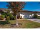 Charming home with a well-maintained lawn, manicured shrubs, and a two-car garage at 3663 Muirfield Dr # 4B, Sarasota, FL 34238