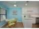 Kitchen with breakfast nook, white cabinets, and modern appliances at 3663 Muirfield Dr # 4B, Sarasota, FL 34238