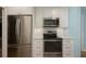 Updated kitchen features stainless steel appliances and ample storage space at 3663 Muirfield Dr # 4B, Sarasota, FL 34238