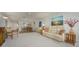 Spacious living room open to dining area, featuring comfortable seating at 3663 Muirfield Dr # 4B, Sarasota, FL 34238