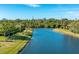 Beautiful waterway showcasing lush green landscaping and sunny skies, great for nature lovers at 3663 Muirfield Dr # 4B, Sarasota, FL 34238