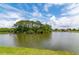 Enjoy the peace and beauty of the lake with an island, visible from the homes on the community waterfront at 3663 Muirfield Dr # 4B, Sarasota, FL 34238