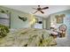 Main bedroom with a king-size bed and tropical decor at 3844 Wilshire W Cir # 20, Sarasota, FL 34238