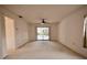 Bright bedroom with sliding glass doors to a pool view at 3947 Country View Dr, Sarasota, FL 34233