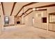 Living room features high ceilings, exposed beams, and a stone fireplace at 3947 Country View Dr, Sarasota, FL 34233
